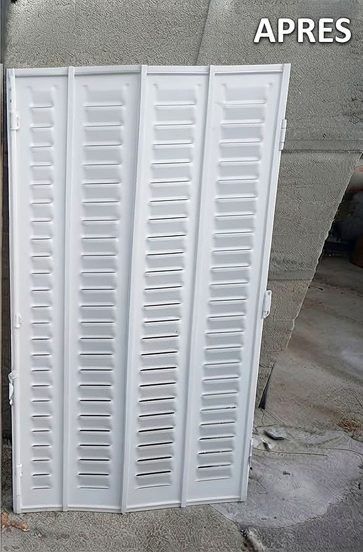 Après rénovation : persienne en fer sablée et thermolaquée blanche